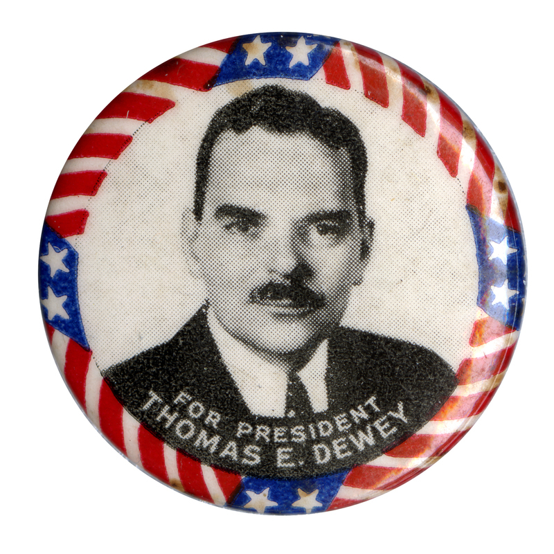 Round, white button with a grayscale portrait of Thomas Dewey and a US flag border. White text below the portrait reads "For President Thomas E Dewey". 