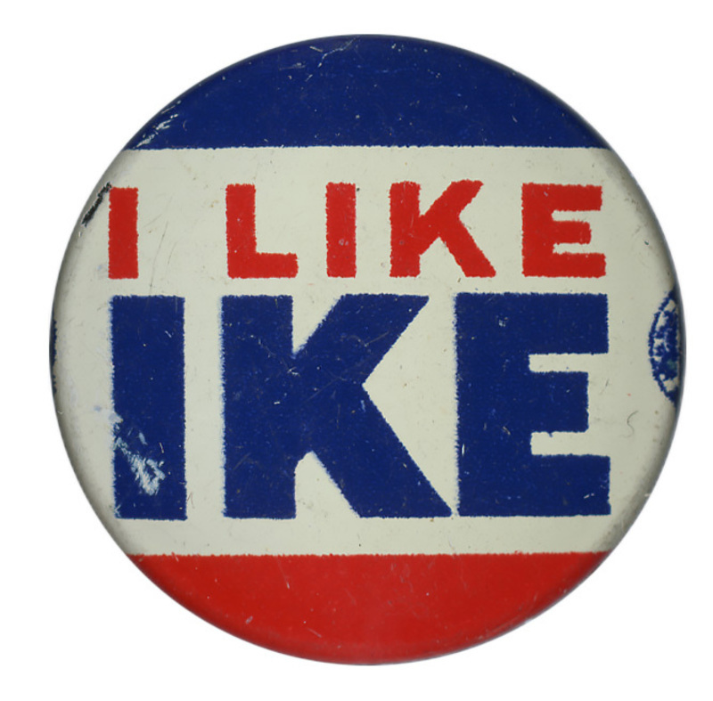 Round button with three horizontal blue, white, and red stripes. Red and blue text reads "I like Ike" across the center white stripe.