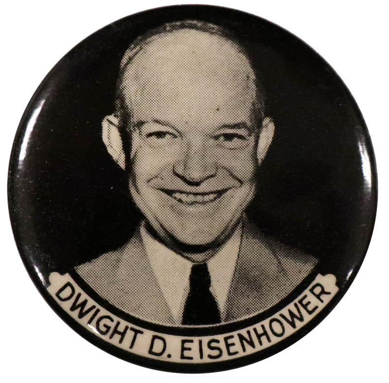 Round, black button with a grayscale portrait of Dwight D. Eisenhower at the center. A white banner below the portrait reads "Dwight D. Eisenhower" in black text. 