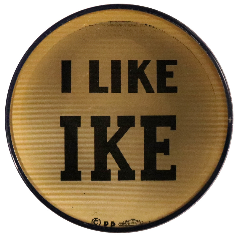 Round, black and white button with the text "I Like Ike." This is one angle of a holographic button.