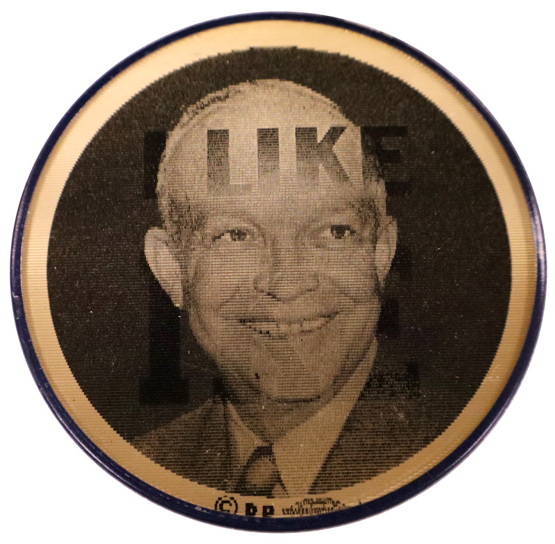 Round, black and white button with a photograph of Dwight D. Eisenhower. This is one angle of a holographic button.