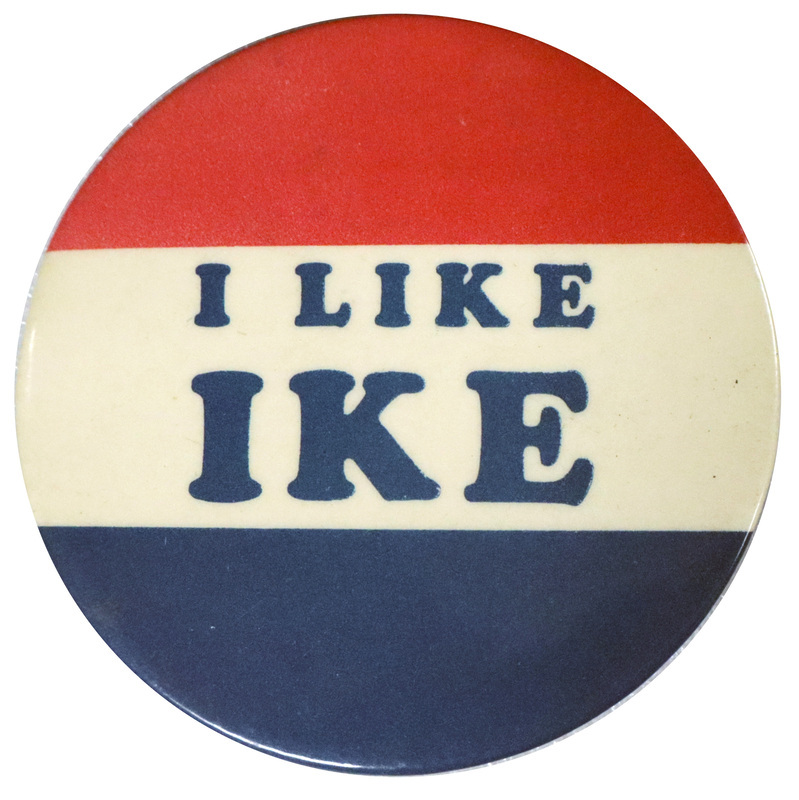 Round button with three horizontal stripes of red, white, and blue. Bold blue font reads "I like Ike" on the center white stripes.