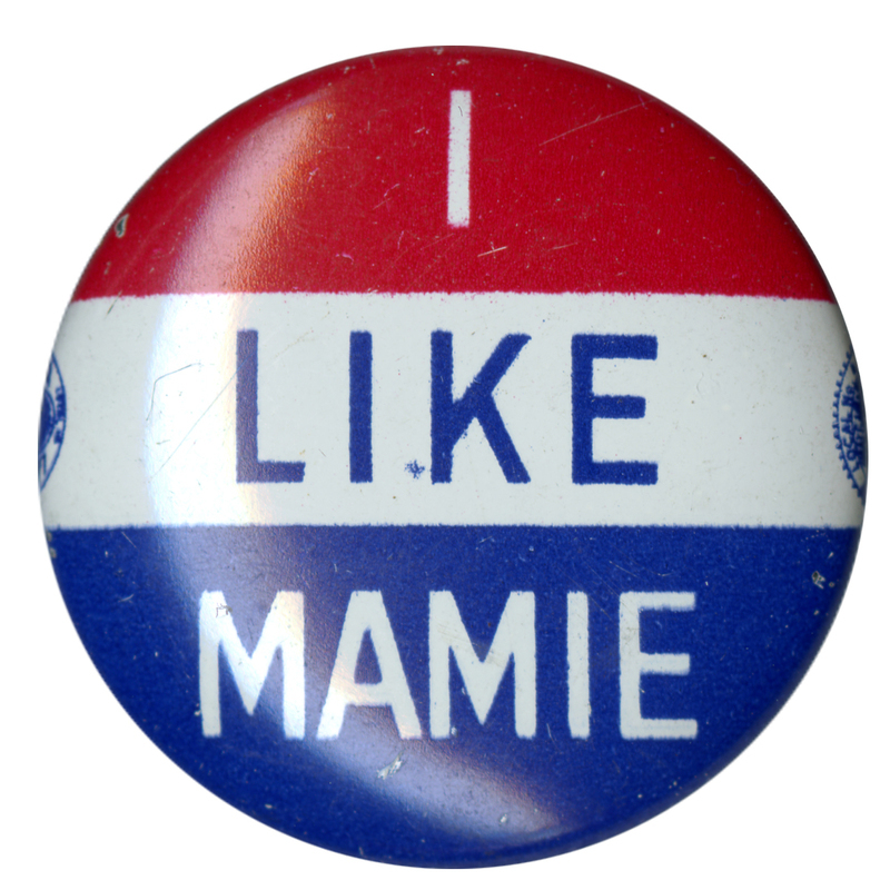 Round button with three horizontal stripes of red, white, and blue. Text across all three stripes reads "I like Mamie". 