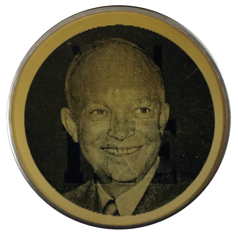 Round, black and white button with a photograph of Dwight D. Eisenhower. This is one angle of a holographic button.