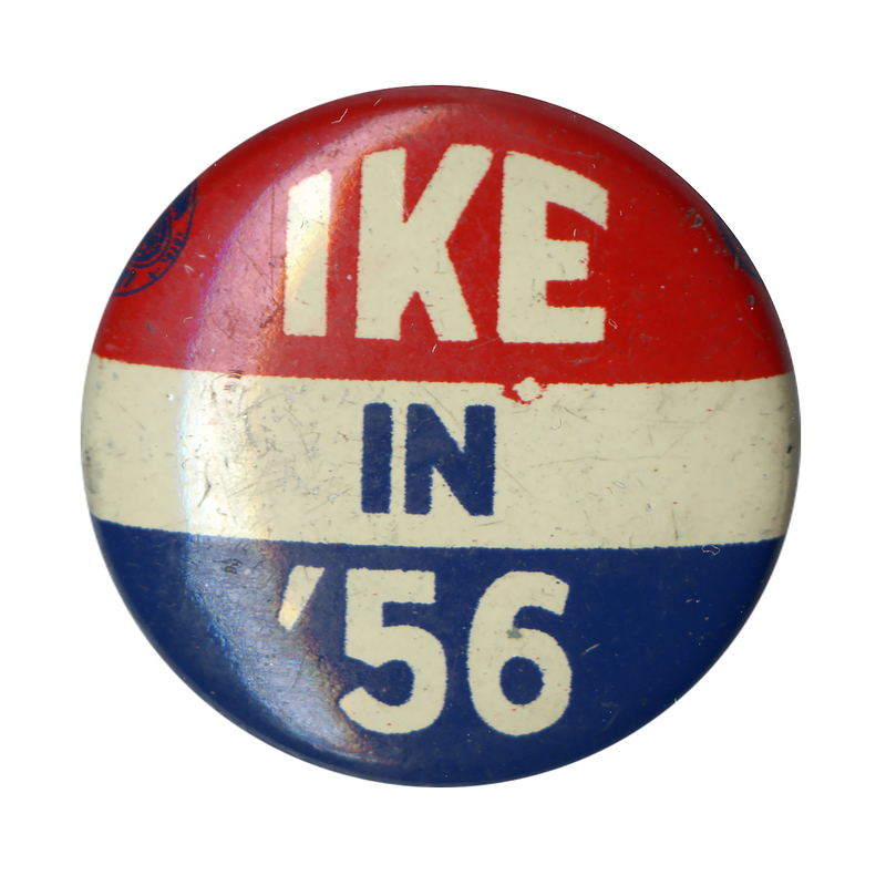 Round button with three horizontal stripes of red, white, and blue. White and blue text reads "Ike in '56". 