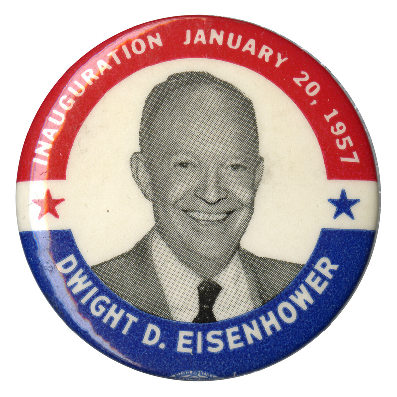 Round, white button with a blue and red border and a grayscale portrait of Dwight D. Eisenhower. White text encircling the portrait reads "Inauguration January 20, 1957 Dwight D. Eisenhower". Two decorative stars are on either side of the portrait. 