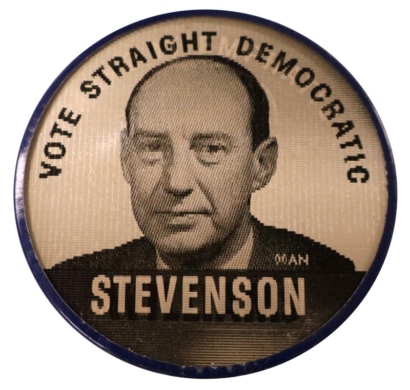 Round, black and white button with a photograph of Adlai Stevenson and the text "Vote Straight Democratic, Stevenson." This is one angle of a holographic button.