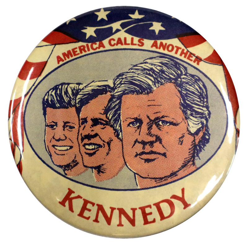 Round, white button with portraits of John F. Kennedy, Robert F. Kennedy, and Ted Kennedy. Ted Kennedy's portrait is foregrounded. The portraits are framed by a US flag design. Red text reads "America calls another Kennedy". 