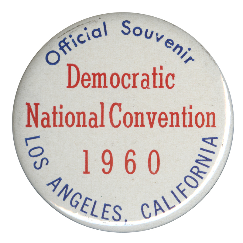 Round, white button with blue and red text reading "Official souvenir Democratic National Convention 1960 Los Angeles, California". 