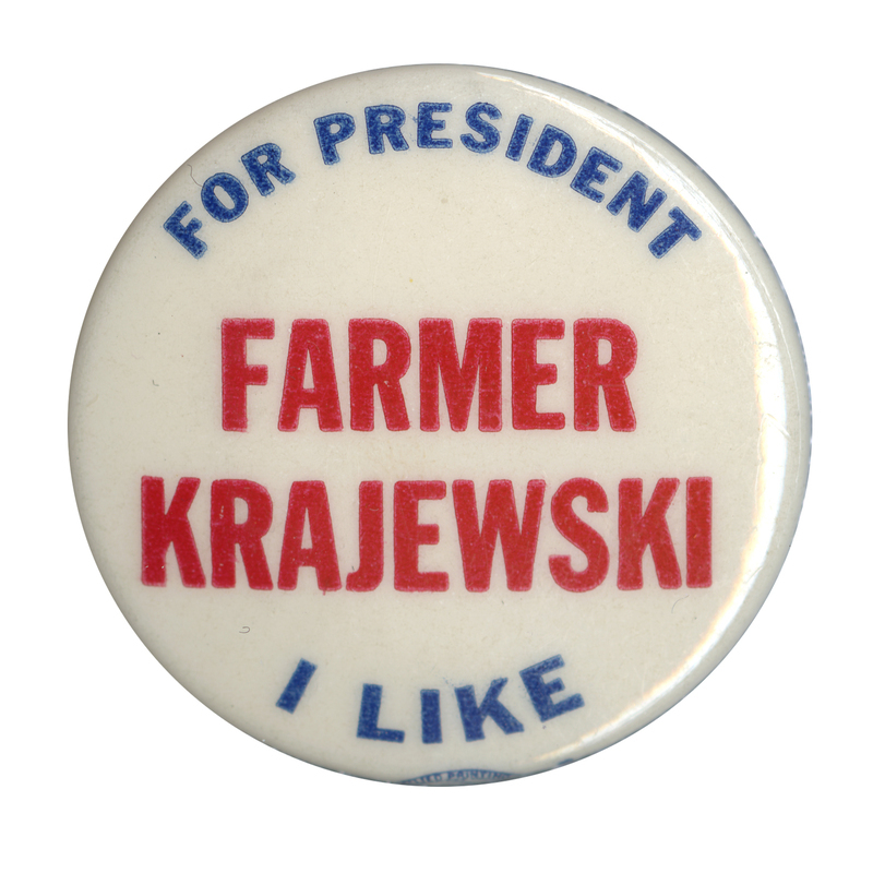 Round, white button with red and blue text reading "For President I like Farmer Krajewski". 