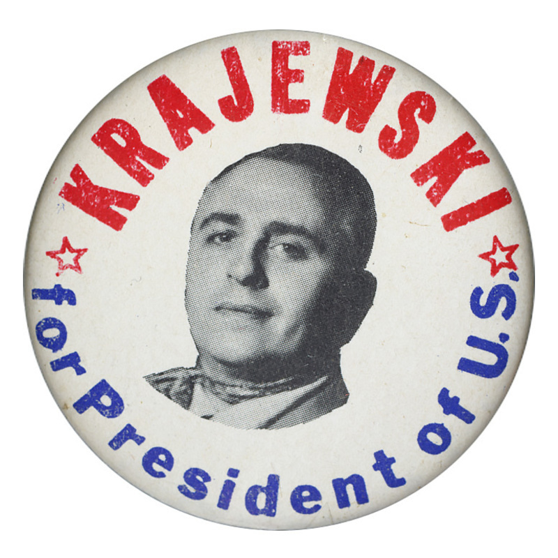 Round, white button with a grayscale portrait of Henry Krajewski. Red and blue text encircling the portrait reads "Krajewski for President of U.S." Two red stars sit on either side of the portrait. 