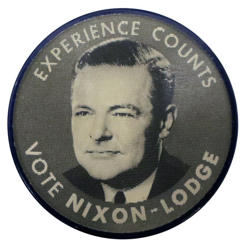 Round, black and white button with a portrait of Henry Cabot Lodge, Jr., and the text "Experience Counts, Vote Nixon-Lodge." This is one angle of a holographic button.