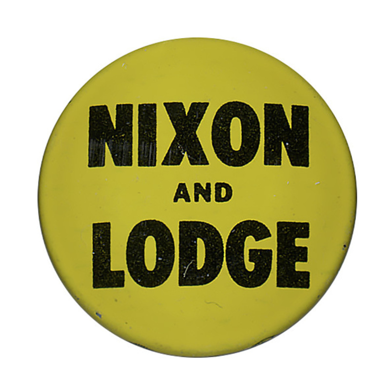 Round, yellow button with dark text reading "Nixon and Lodge". 