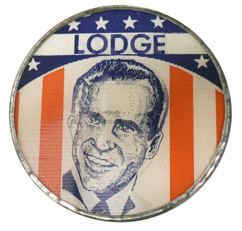 Round button with US flag decorations and a portrait with text reading "Lodge." This is one angle of a holographic button.