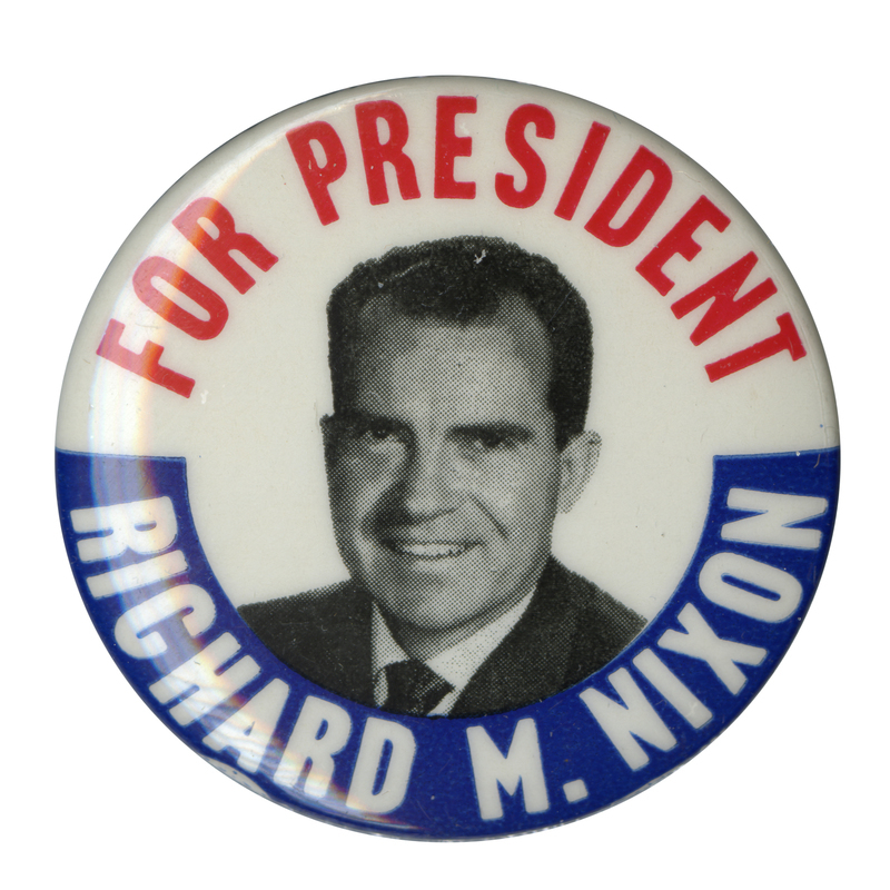 Round, white button with a blue border at the bottom, and a grayscale portrait of Richard M. Nixon at the center. Red and white text reads "For President Richard M. Nixon". 