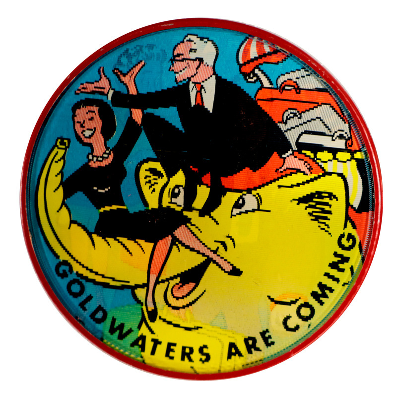 Round button with colorful cartoon images of Lyndon and Lady Bird Johnson with their suitcases, two dogs, and a donkey, leaving the White House. Text reads: "Start Packing". This is one angle of a holographic button.