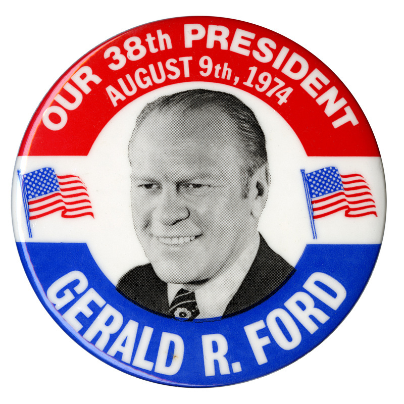 Round, white button with red and blue bands and a black and white portrait of Gerald Ford between two color US flags. White text reads "OUR 38th PRESIDENT AUGUST 9th, 1974 GERALD R. FORD"