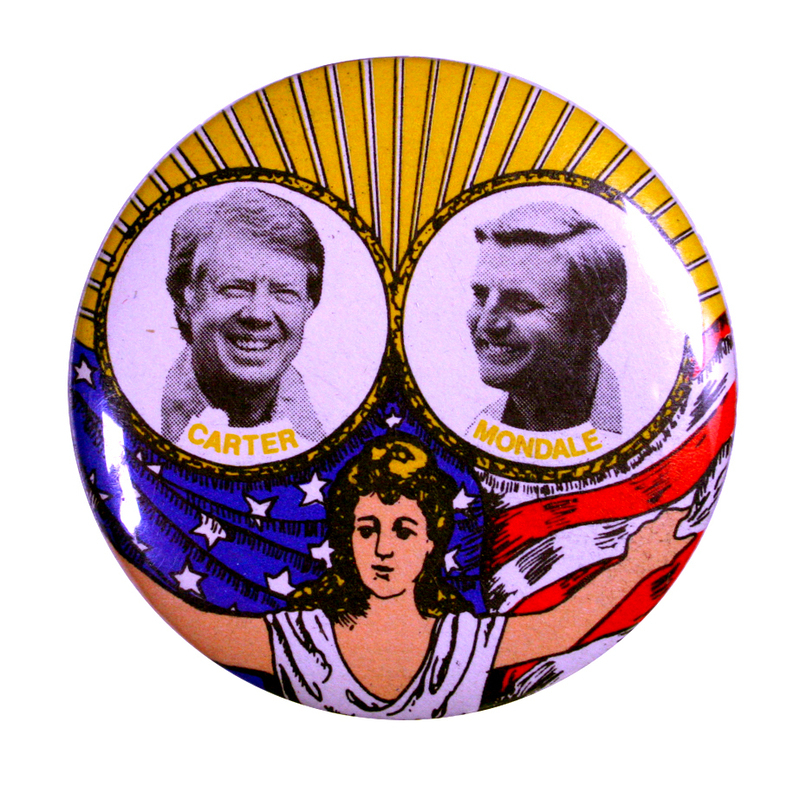 Round button with a color drawing of a woman in a white dress holding up the US flag. The top half of the button has black and white photographs of Jimmy Carter and Walter Mondale against a background of white and yellow rays. Yellow text underneath the portraits reads "CARTER MONDALE"