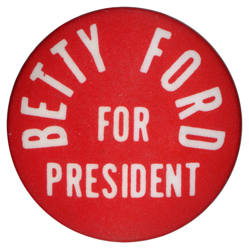Round, red button with white text reading "BETTY FORD FOR PRESIDENT"
