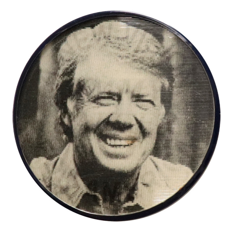 Round, white button with black text reading "A NEW VISION FOR AMERICA JIMMY CARTER." This is one angle of a holographic button.