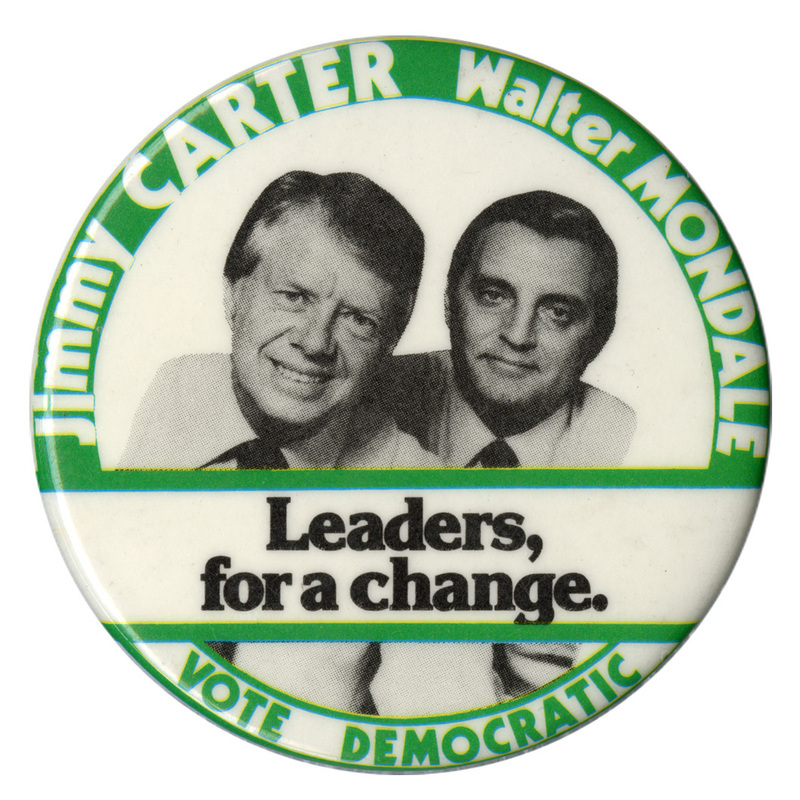 Round, white button with a green border and black and white photograph of Jimmy Carter and Walter Mondale. White and black text reads "Jimmy CARTER Walter MONDALE Leaders, for a change. VOTE DEMOCRATIC"