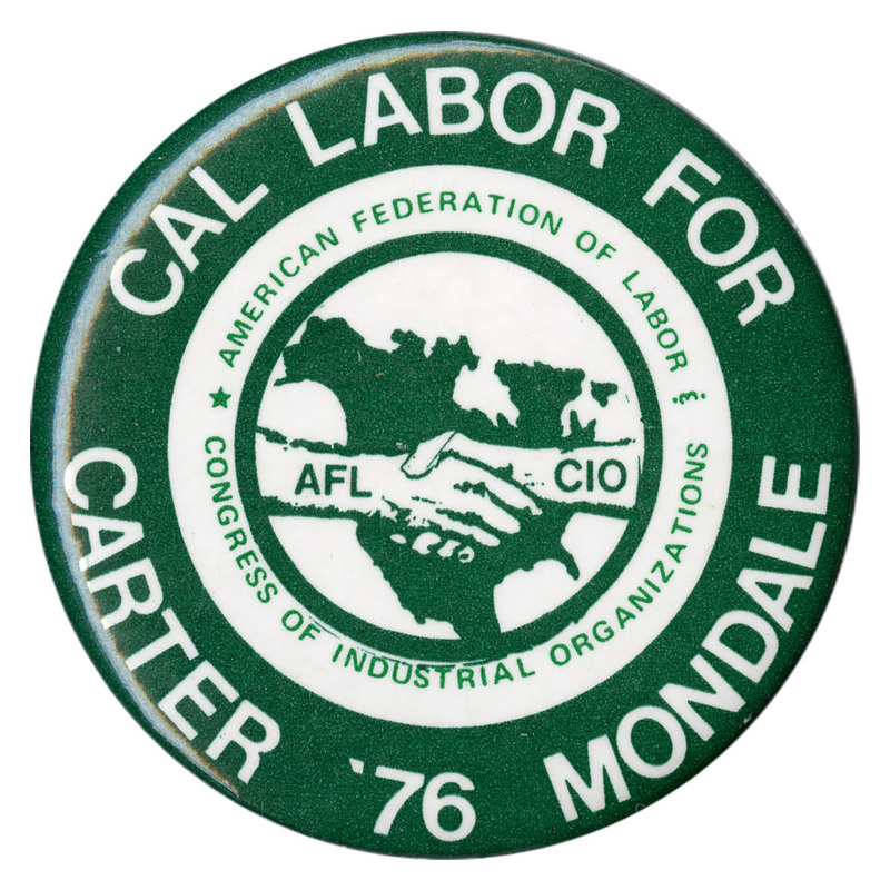 Round, black and white button with a drawing of two hands, labeled "AFL" and "CIO", shaking against a black outline of the United States. White and green text reads "CAL LABOR FOR CARTER '76 MONDALE AMERICAN FEDERATION OF LABOR CONGRESS OF INDUSTRIAL ORGANIZATIONS"