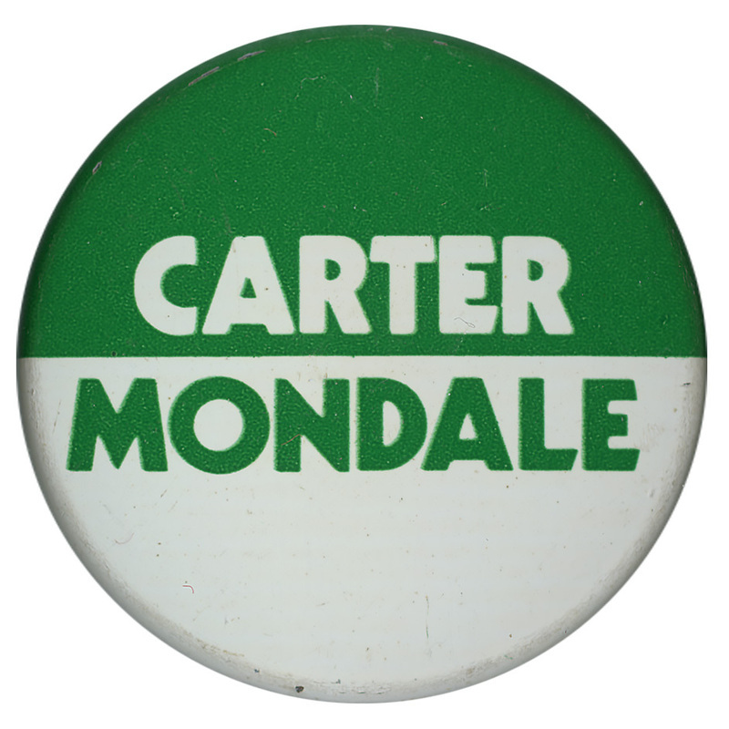 Round, green and white button with white and green text reading "CARTER MONDALE"