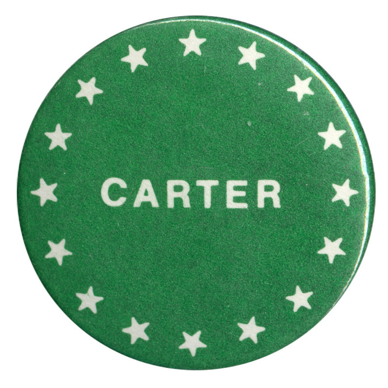 Round, green button with white stars and white text reading "CARTER"
