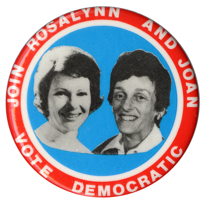 Round, red, white, and blue button with black and white photographs of Rosalynn Carter and Joan Mondale. White text reads "JOIN ROSALYNN AND JOAN VOTE DEMOCRATIC"