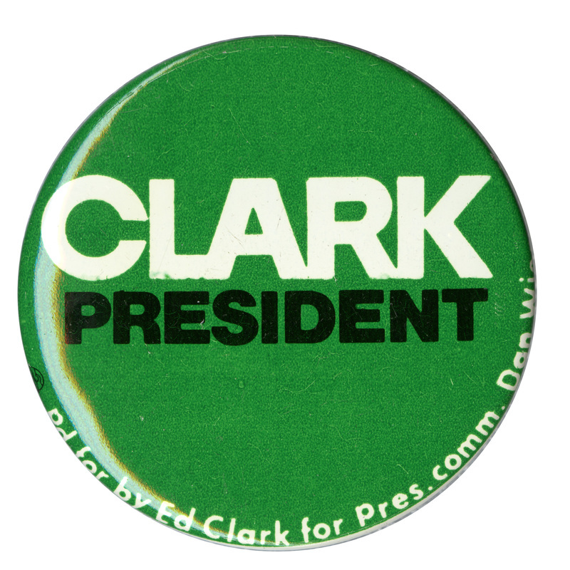 Round, green button with white and black text reading "CLARK PRESIDENT Pd for by Ed Clark for Pres. comm. Dan [illegible]