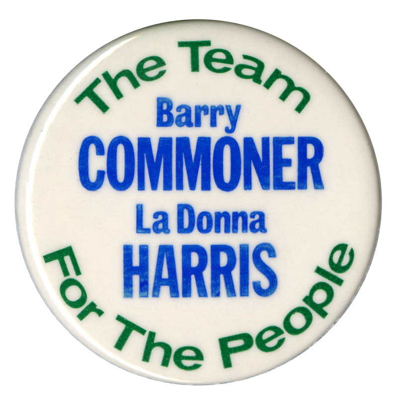 Round, white button with green and blue text reading "The Team For The People Barry COMMONER LaDonna HARRIS"