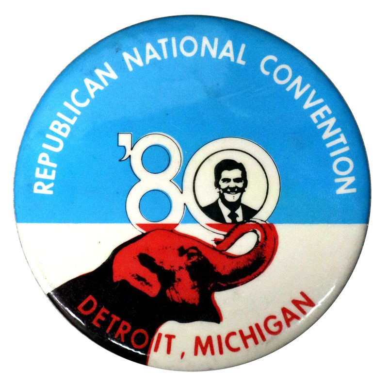 Round, blue and white button with a black and white image of Ronald Reagan and a black and red image of an elephant. White and red text reads "REPUBLICAN NATIONAL CONVENTION '80 DETROIT, MICHIGAN"