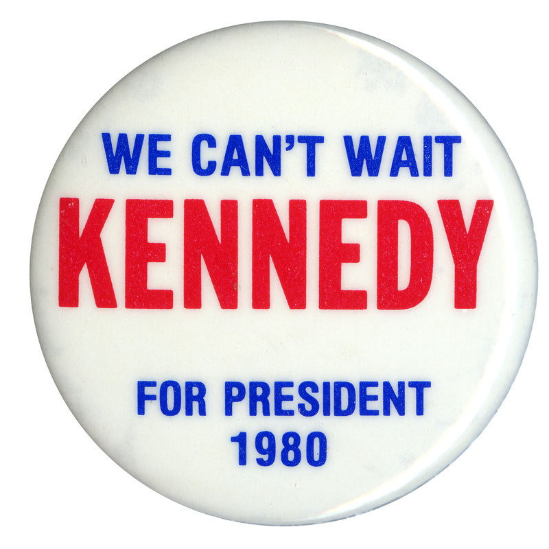 Round, white button with blue and red text reading "WE CAN'T WAIT KENNEDY FOR PRESIDENT 1980"