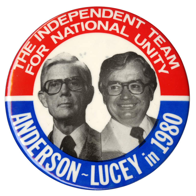 Round button with red and blue border and a black and white photographs of John Anderson and Patrick Lucey in the center. White text reads "THE INDEPENDENT TEAM FOR NATIONAL UNITY ANDERSON-LUCEY in 1980"