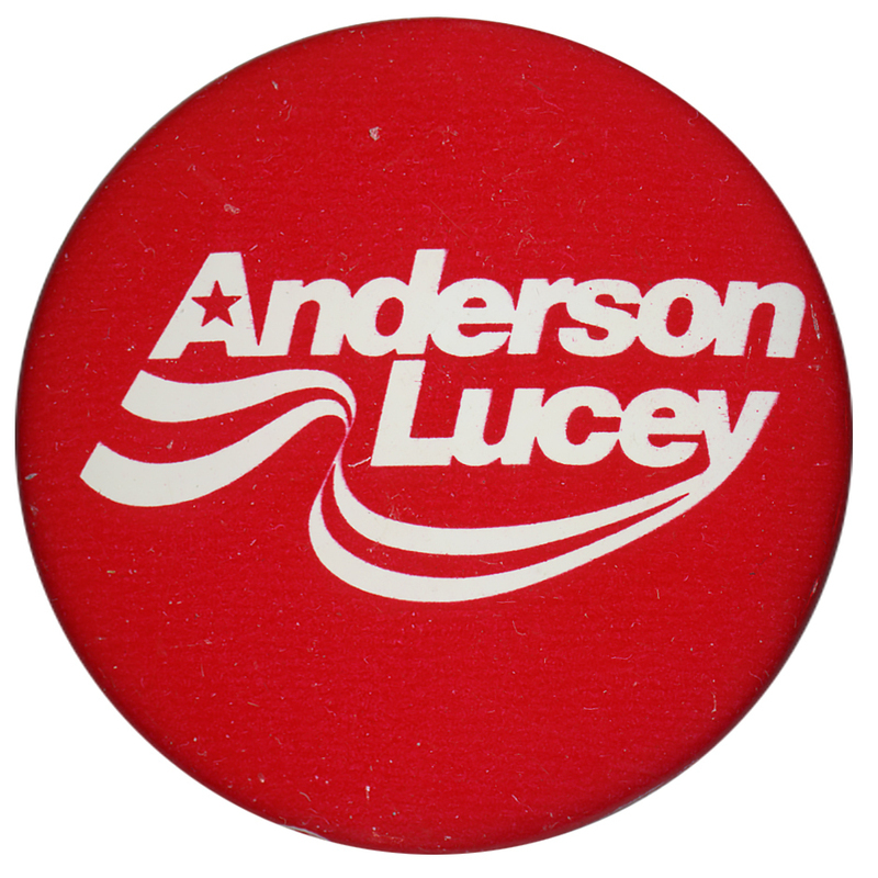 Round, red button with white text reading "Anderson Lucey"
