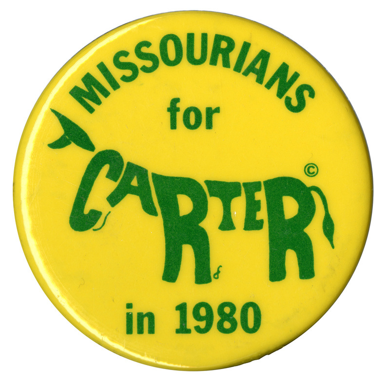 Round, yellow button with green text reading "MISSOURIANS for CARTER in 1980." The letters in the word "CARTER" are formed in the shape of a donkey.