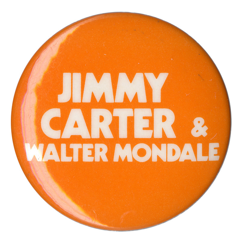 Round, orange button with white text reading "JIMMY CARTER & WALTER MONDALE"