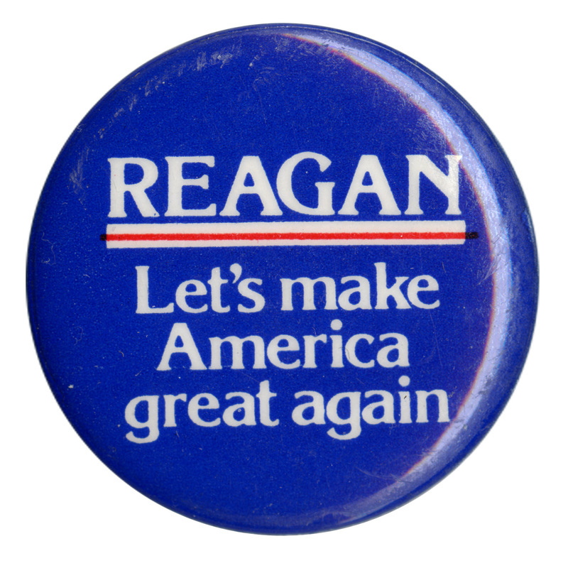 Round, blue button with white text reading "REAGAN Let's make America great again"
