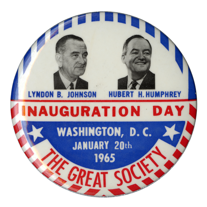 Round, white button with red and blue US flag decorations and portraits of Lyndon B. Johnson and Hubert Humphrey. Text reads "Lyndon B. Johnson, Hubert Humphrey, Inauguration Day, Washington, D.C., January 20th, 1965, The Great Society."