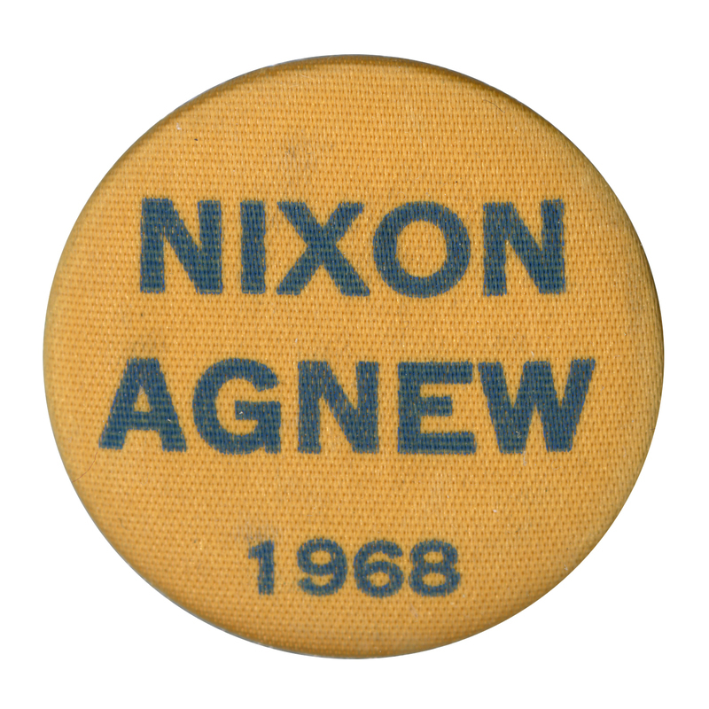 Round, gold button with a fabric texture and black text reading "Nixon Agnew 1968"