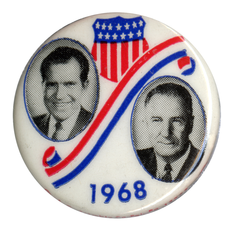 Round, white button with portraits of Richard Nixon and Spiro Agnew accompanied by red, white, and blue shield and ribbon decorations. Text reads "1968."