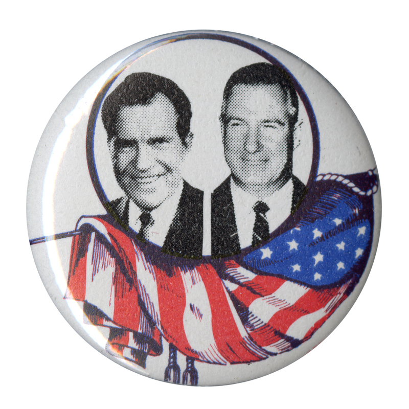Round, white button with black and white portraits of Richard Nixon and Spiro Agnew with a red, white, and blue flag draped along the lower half od the button.
