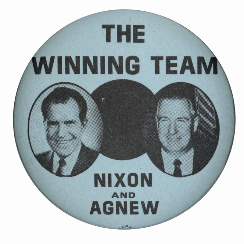 Round, white button with portraits of Richard Nixon and Spiro Agnew in black-outlined circles. Black text reads "The winning team, Nixon and Agnew."