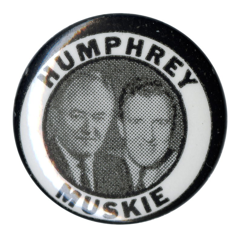 Round, black and white button with portraits of Hubert Humphrey and Edmund Muskie. Black text reads "Humphrey Muskie."