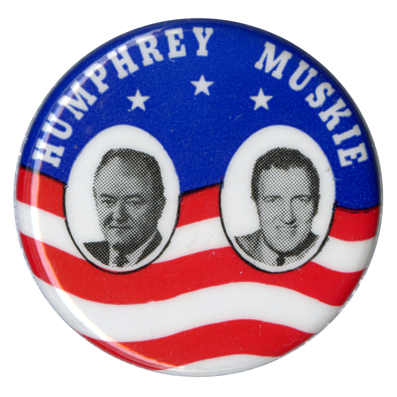 Round button with red, white, and blue flag design and portraits of Hubert Humphrey and Edmund Muskie. White text reads "Humphrey Muskie."