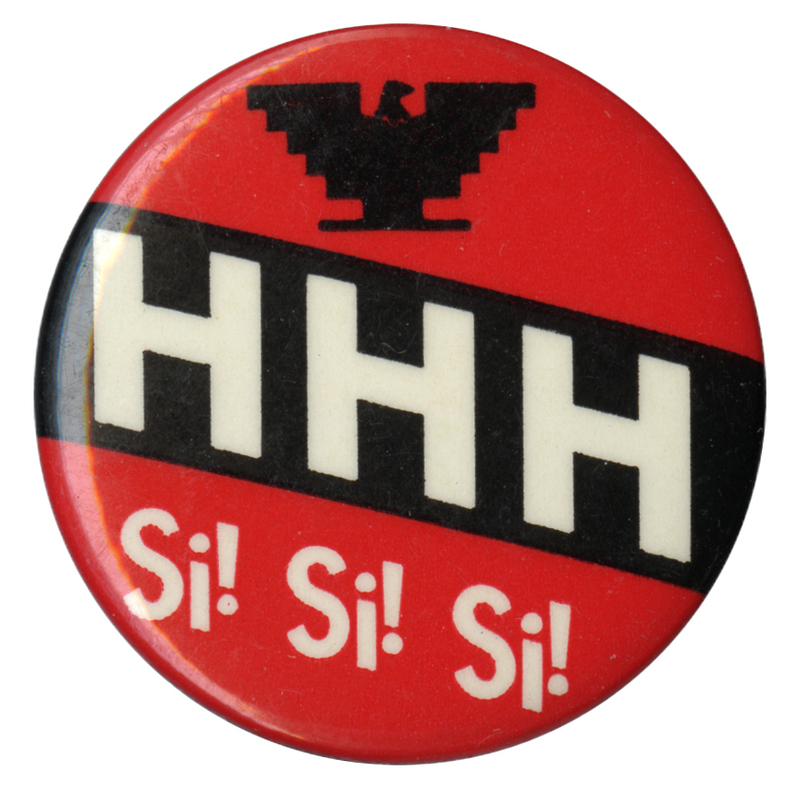 Round, red button with the blocky eagle symbol of the United Farm Workers in black and white text reading "HHH Si! Si! Si!"