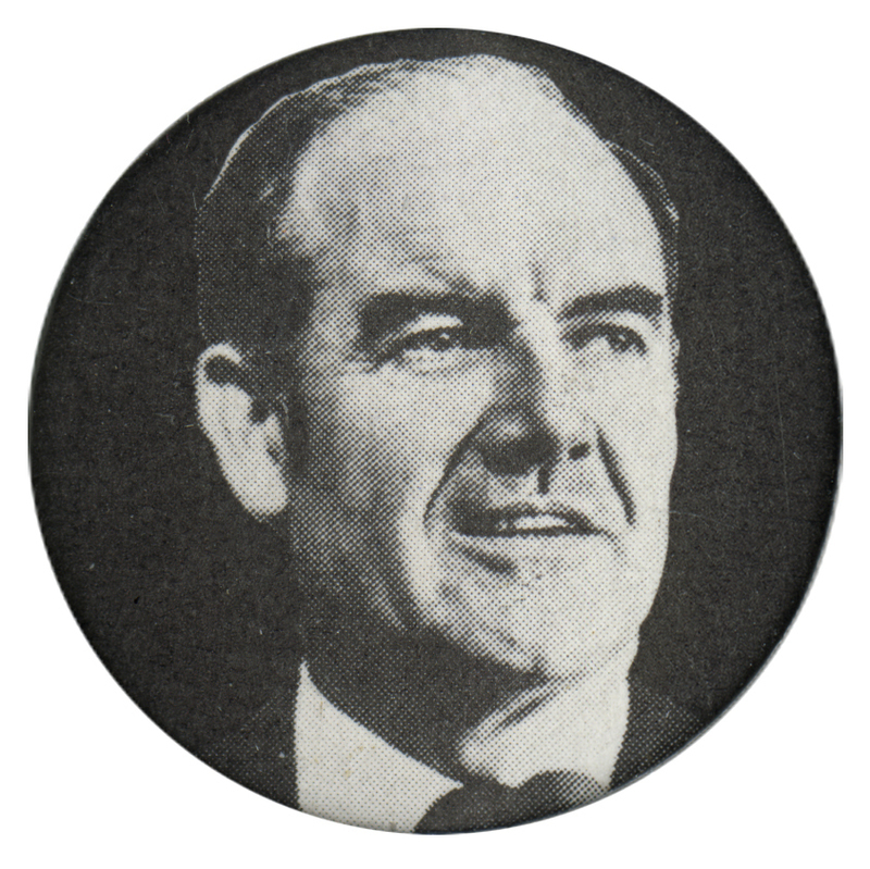 Round, black button with a black and white portrait of George McGovern.