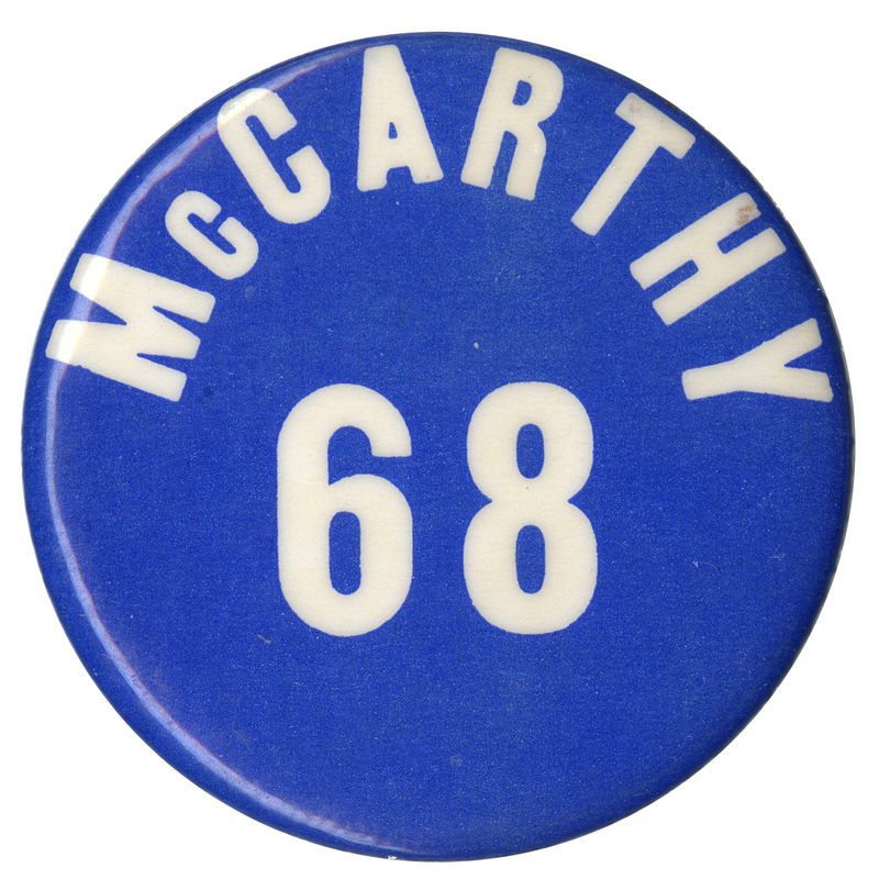Round, blue button with white text reading "McCarthy 68."