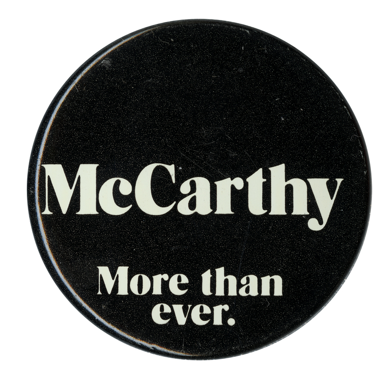 Round, black text with white text reading "McCarthy, More than ever."