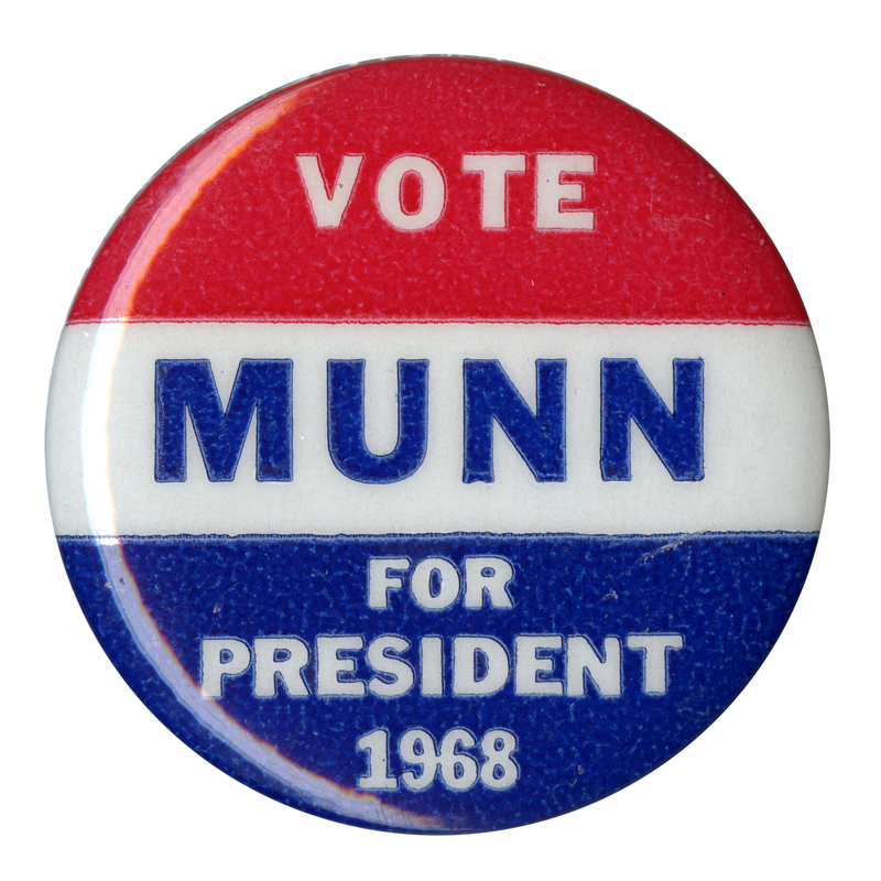 Round, red, white, and blue button with text reading "Vote Munn for president 1968."